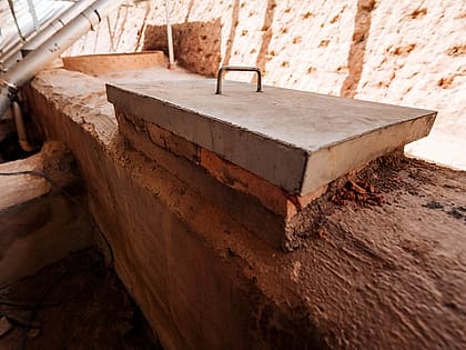 Concrete lid over a decantation channel beside a carbonisation kiln
